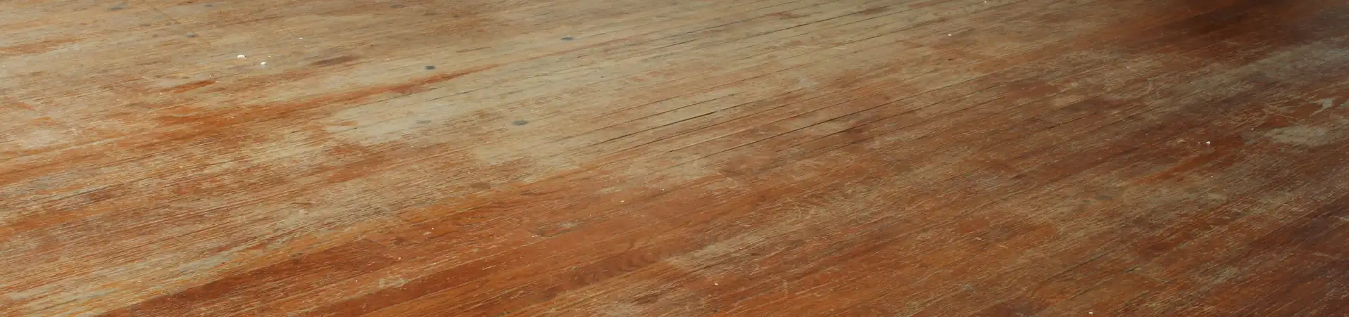 Photo of scratched and scuffed hardwood floor