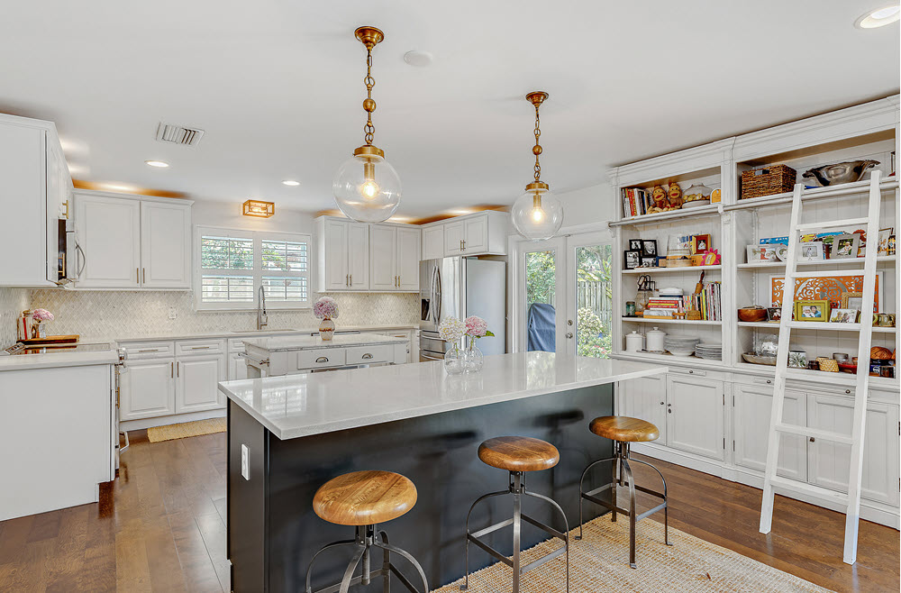 White kitchen cabinets and bookshelf