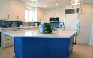 New blue cabinets installed on a kitchen island