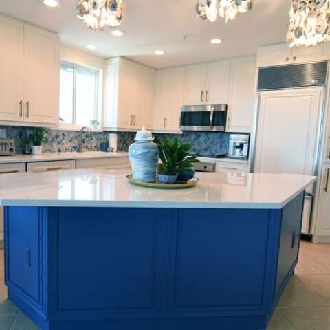 New blue cabinets installed on a kitchen island