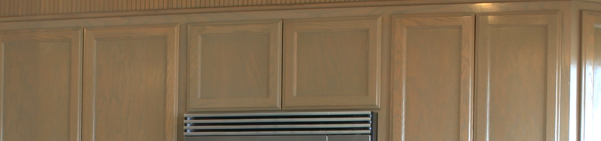 Photo of kitchen with blue and white refinished cabinets