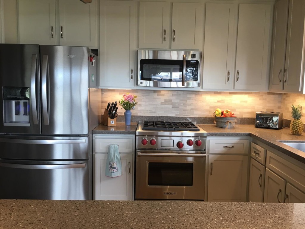 white cabinets in a kitchen after refacing