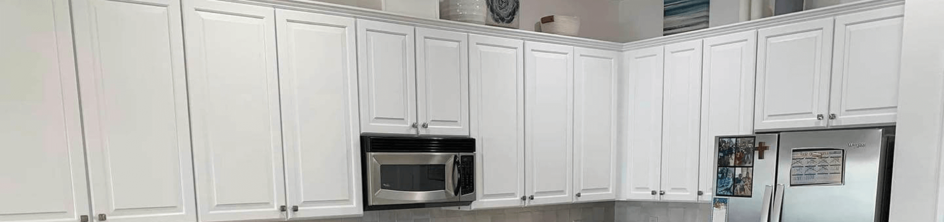 Photo of kitchen with blue and white refinished cabinets