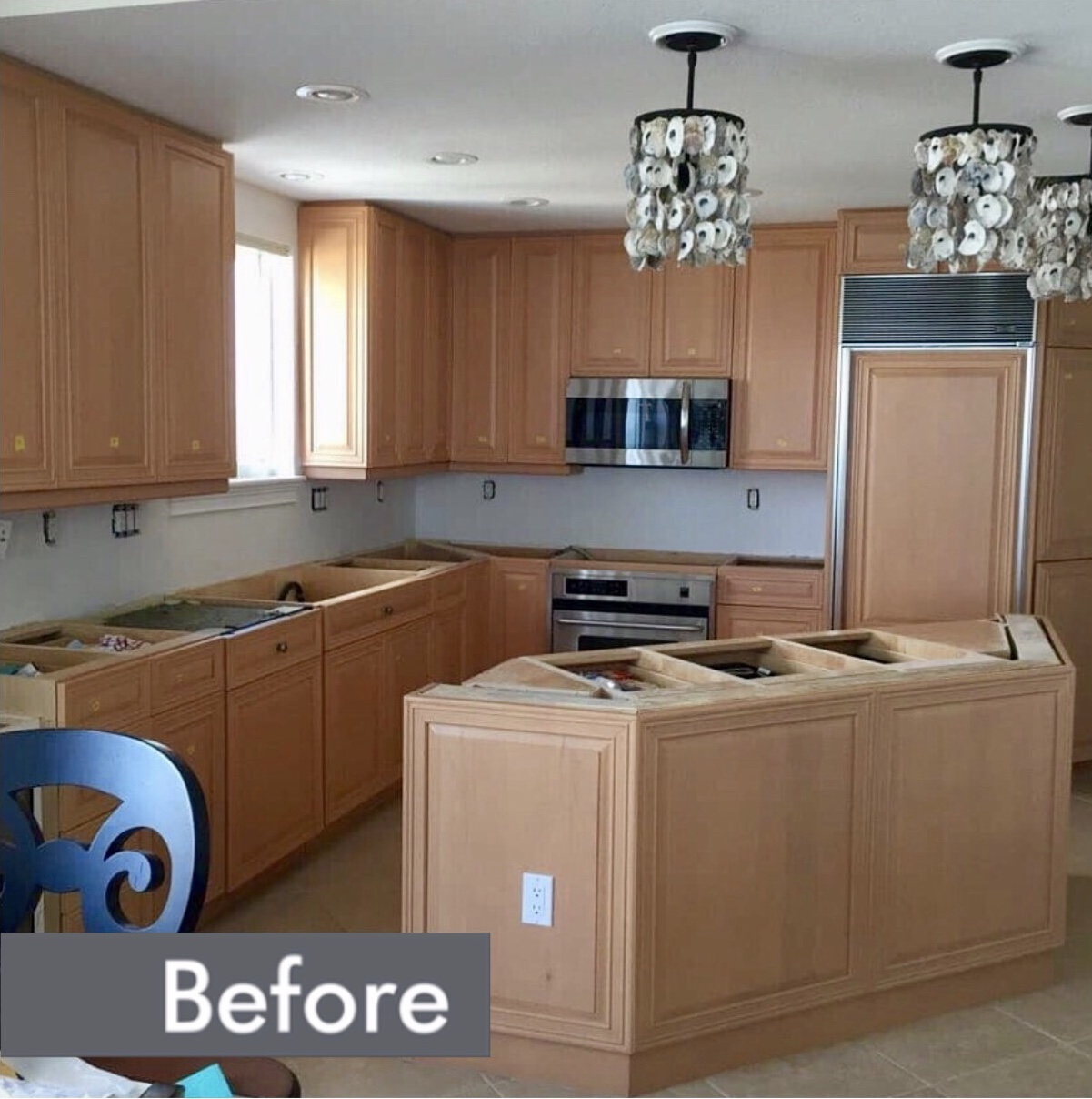 Before-A Boise kitchen before and after a cabinet door replacement service with new hardware