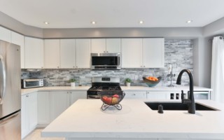 white kitchen with unique tile backsplash