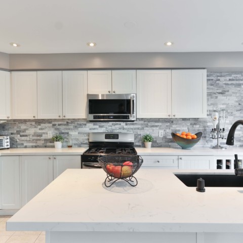 white kitchen with unique tile backsplash
