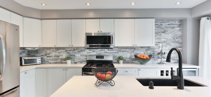 white kitchen with unique tile backsplash