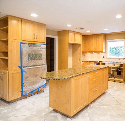 light wood cabinets in a kitchen before painting