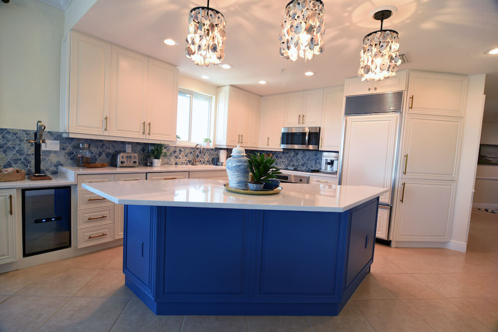 blue and white kitchen cabinets after painting