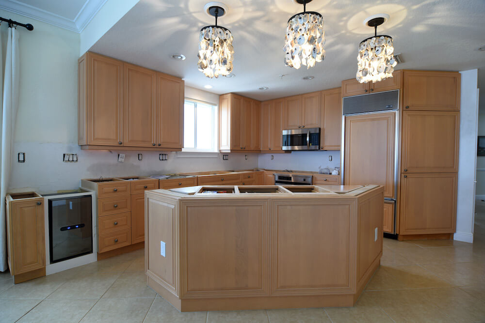 light colored wood kitchen cabinets before refinishing