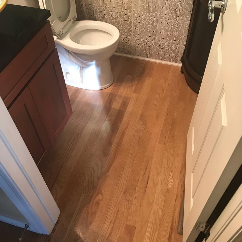 bathroom hardwood floor refinishing before