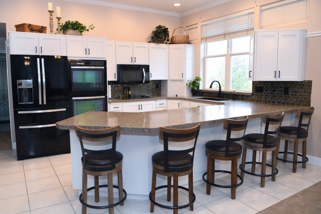 white cabinets in a kitchen after refacing