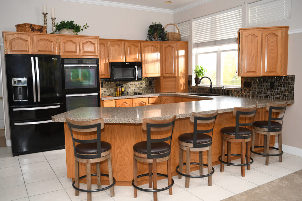 wood cabinets in a kitchen before refacing