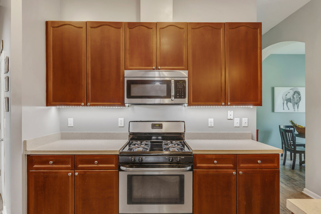 old brown kitchen cabinets before replacement