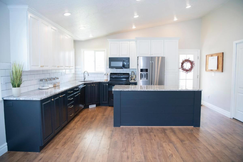 white and blue cabinets in a kitchen after painting