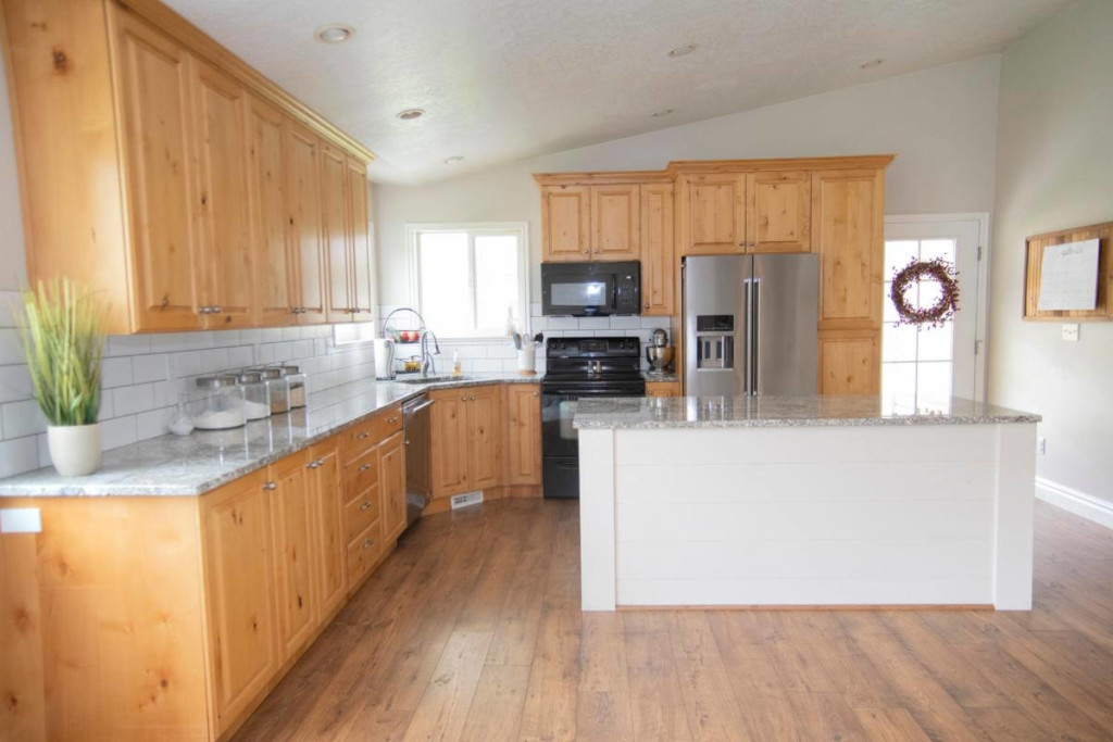 wood cabinets in a kitchen before painting