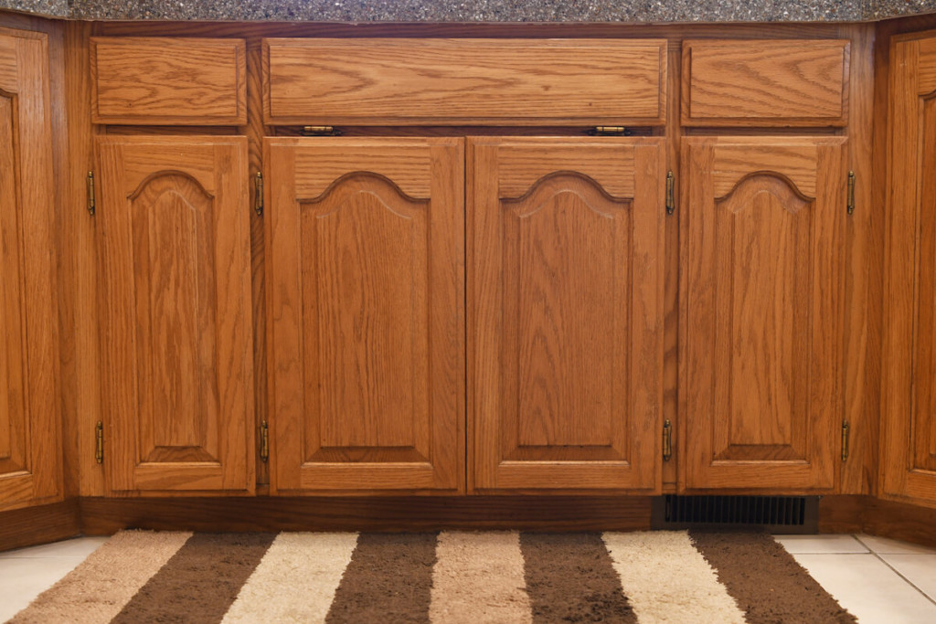 Before-Outdated cabinets to white shaker style