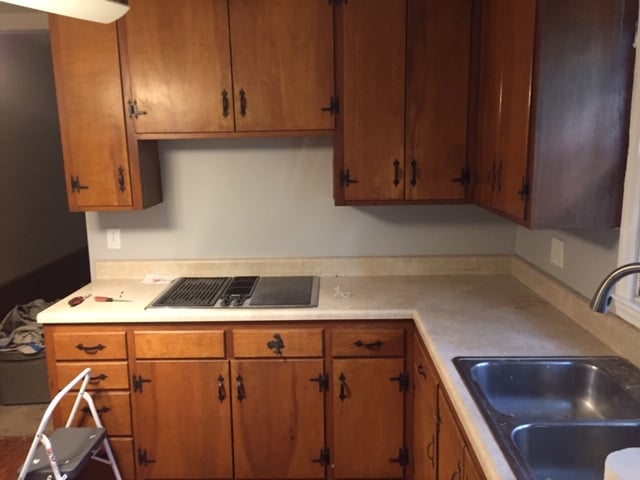 Before-Flat cabinet doors to white shaker style