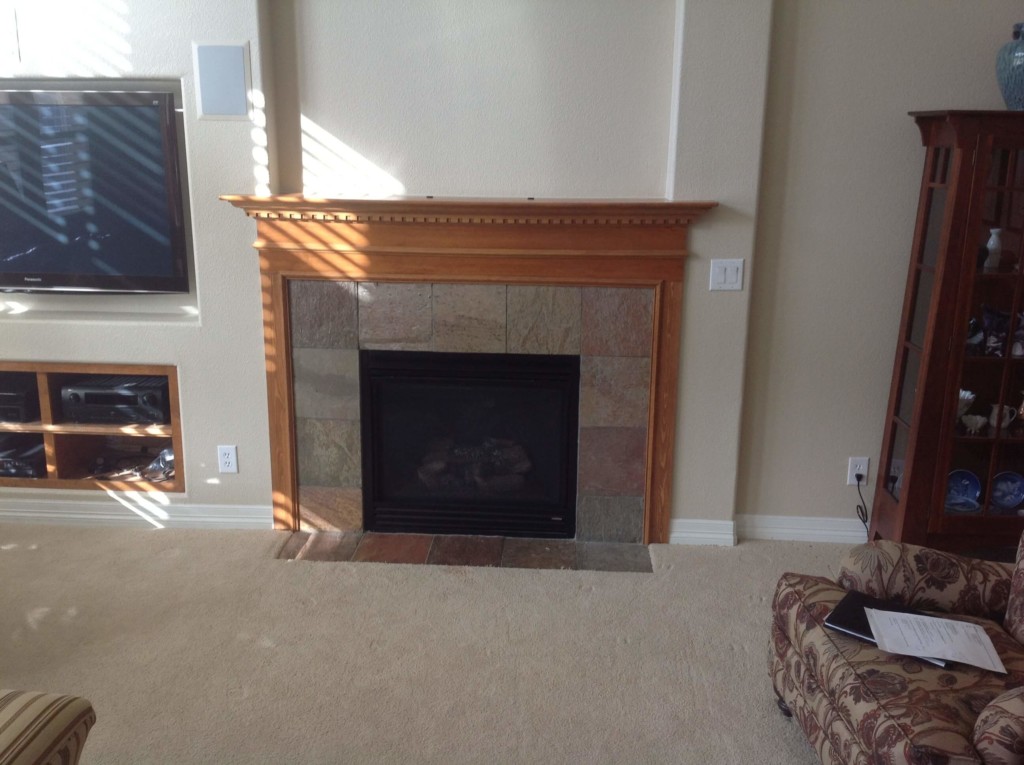 light honey oak fireplace hearth before wood refinishing denver