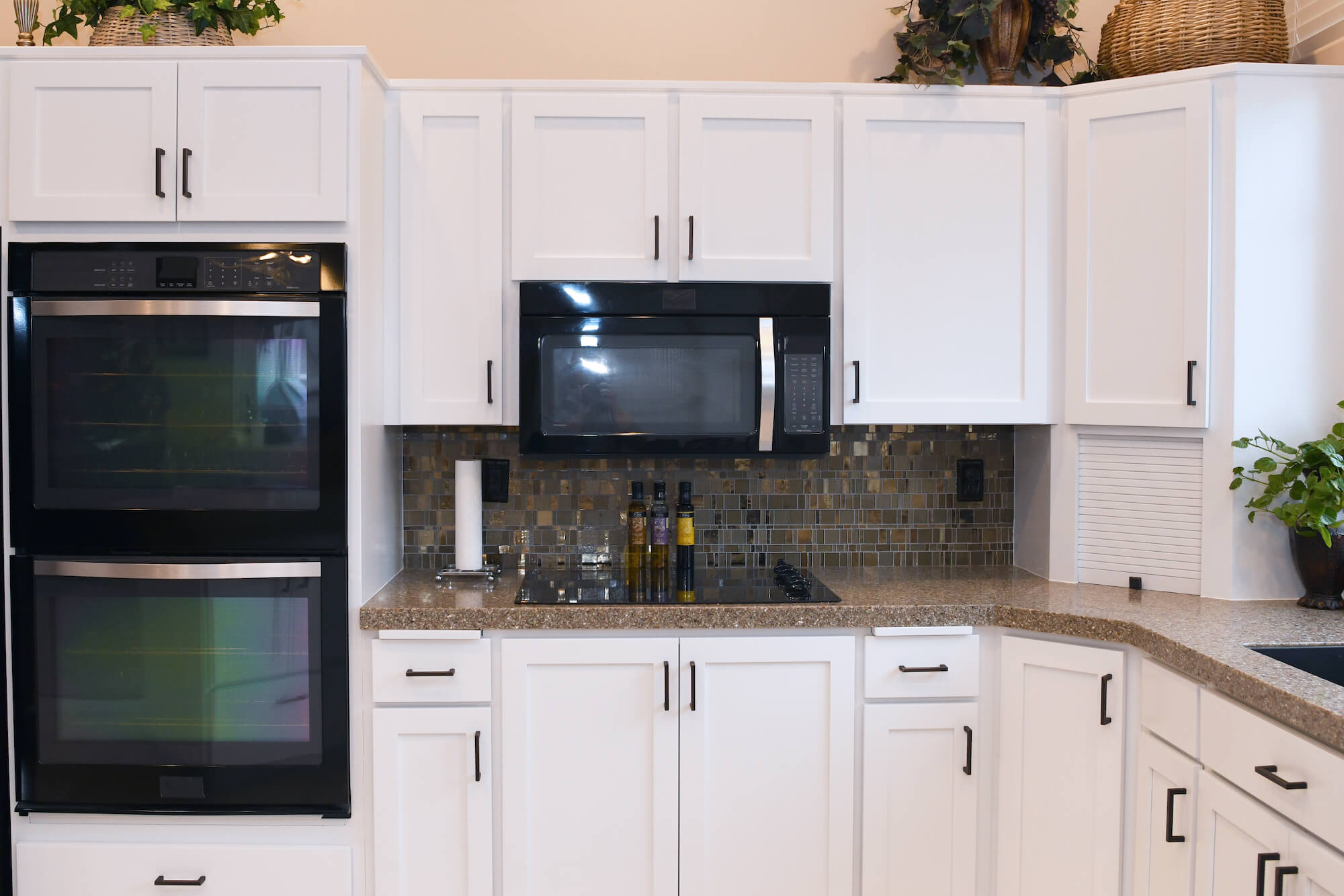 After-Outdated cabinets to white shaker style