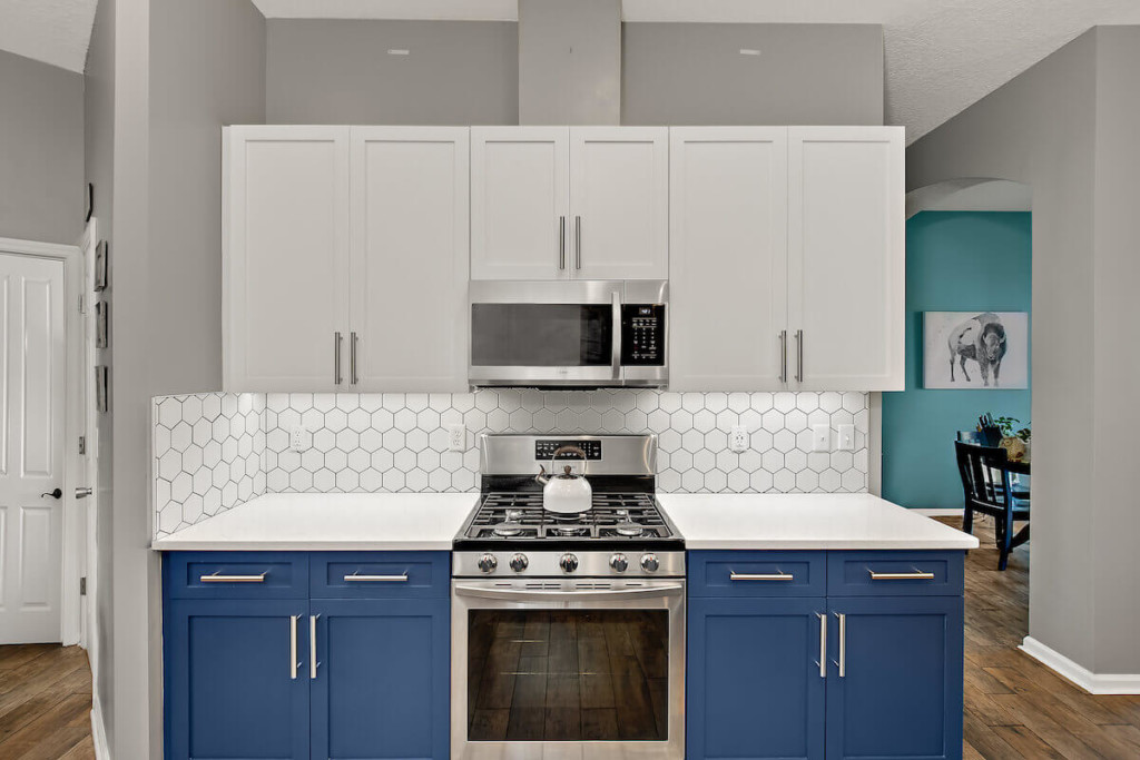 Resurfaced white kitchen cabinets