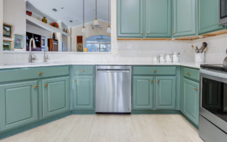 freshly painted sage green cabinets