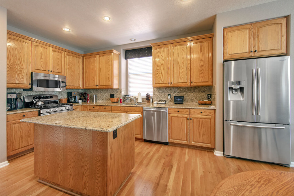 wood cabinets in a kitchen before staining