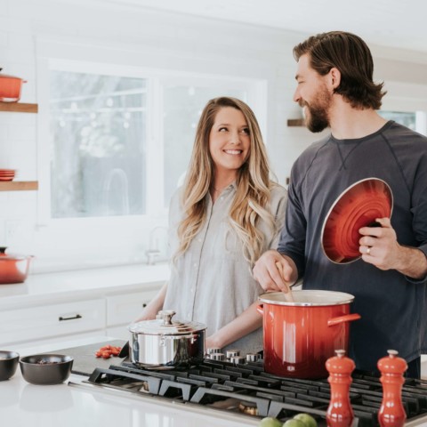 family cooking in kitchen