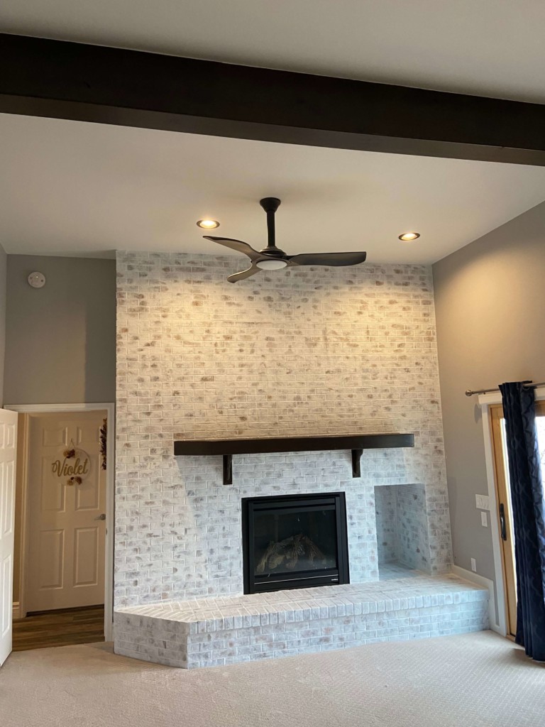 refinished ceiling beam and mantel