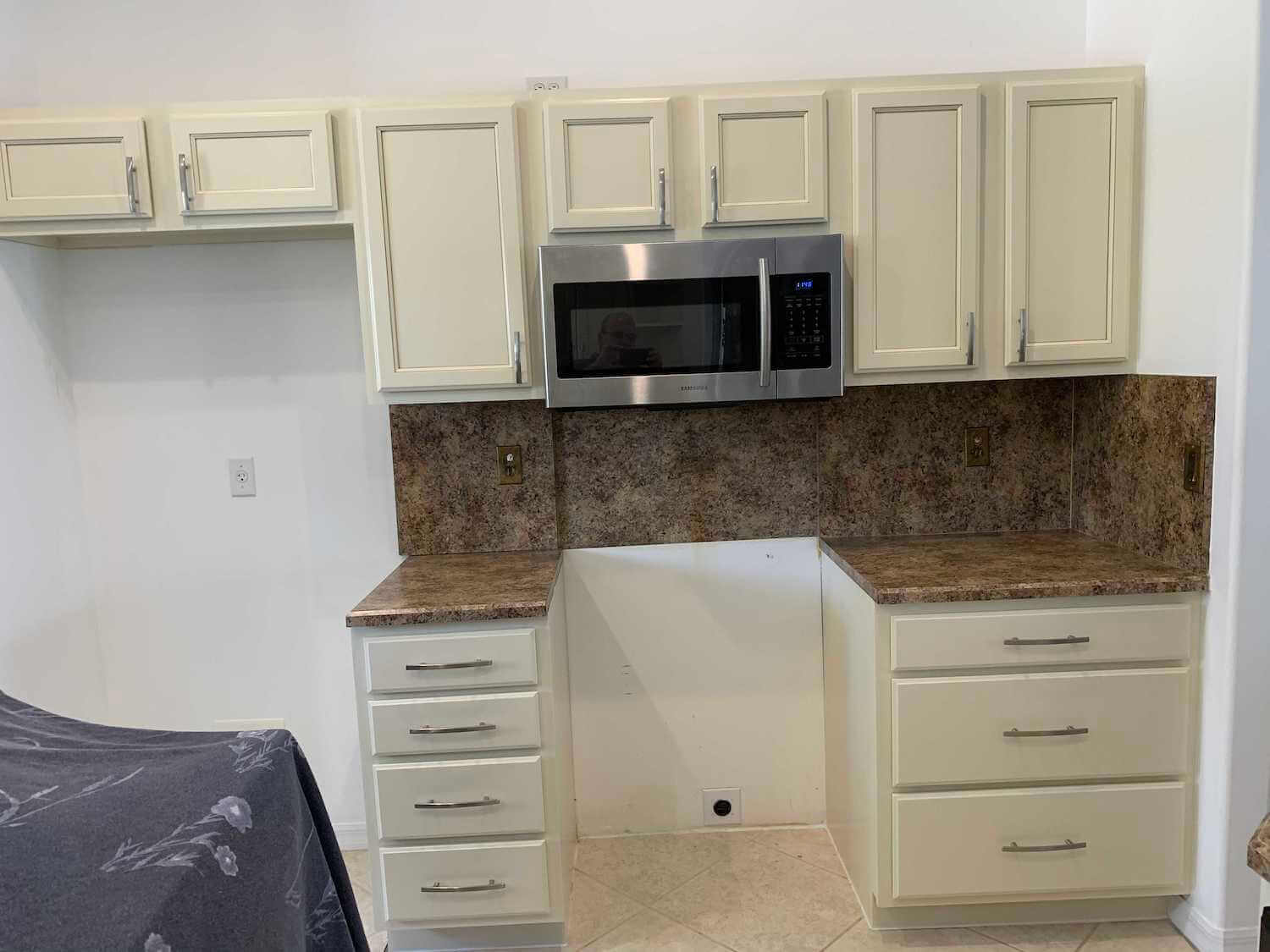 small kitchen after cabinet painting in Vero Beach
