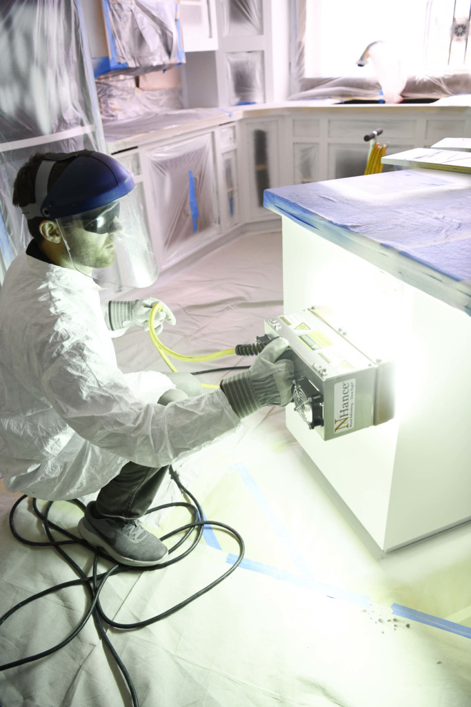 n-hance technician curing paint with UV light