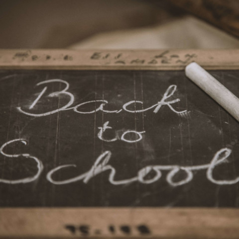 back to school written on chalkboard