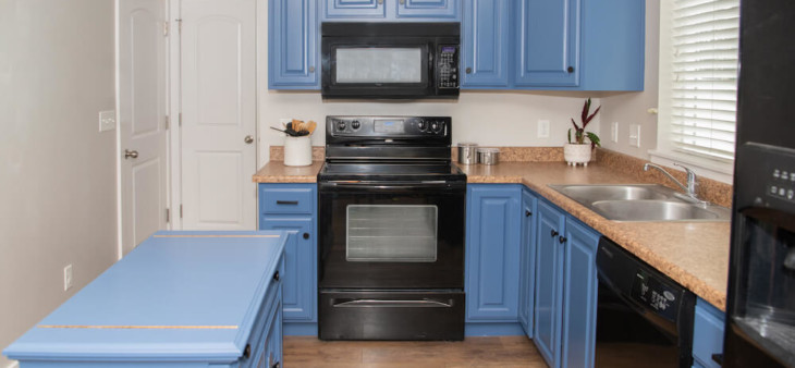 freshly painted blue kitchen cabinets