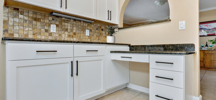 white kitchen cabinet with upgraded hardware