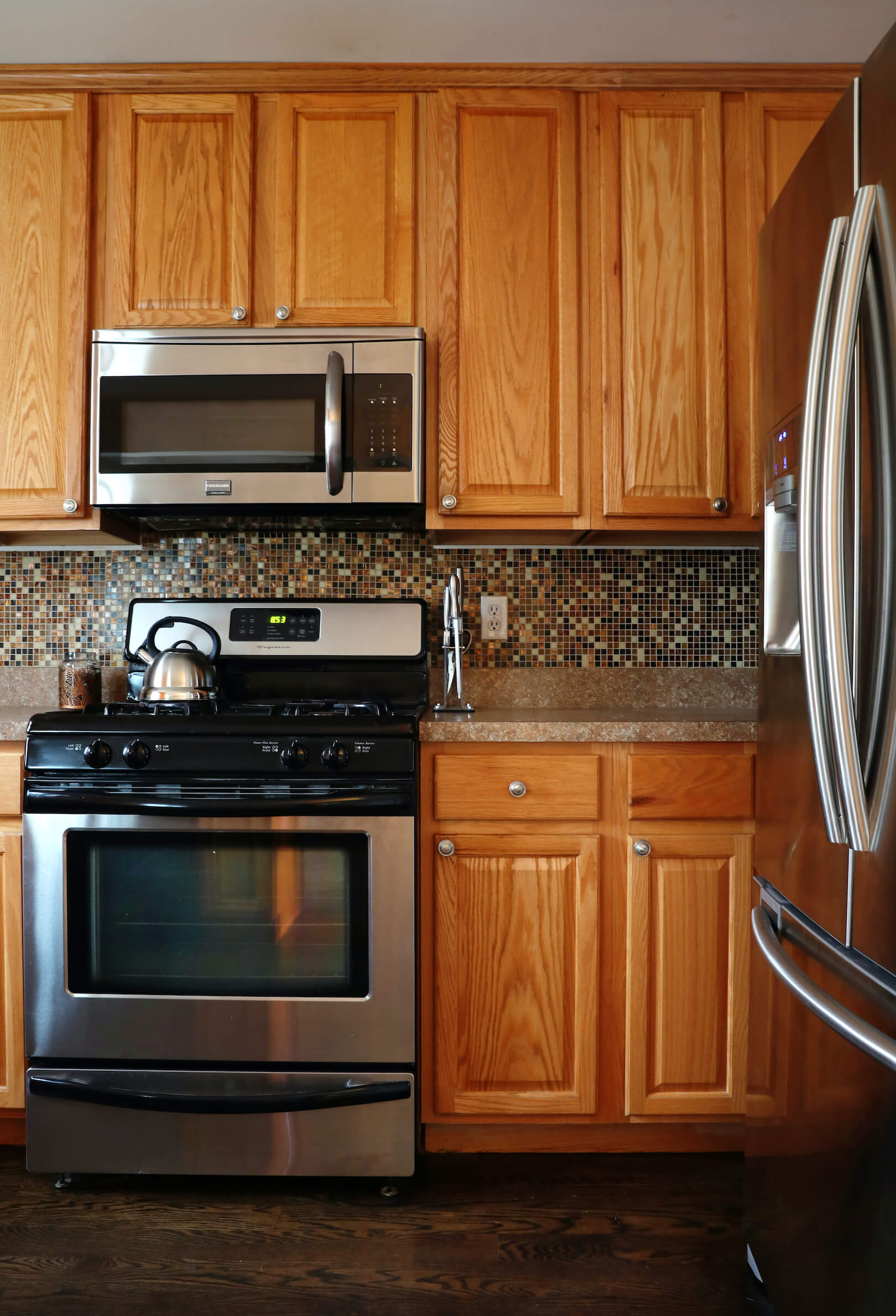 Before-Outdated cabinets to white shaker style