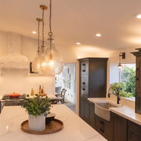 kitchen with white counters and dark brown cabinets