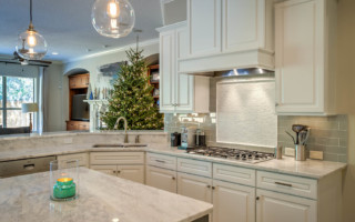 white kitchen cabinets in a kitchen next to a christmas tree in solano county