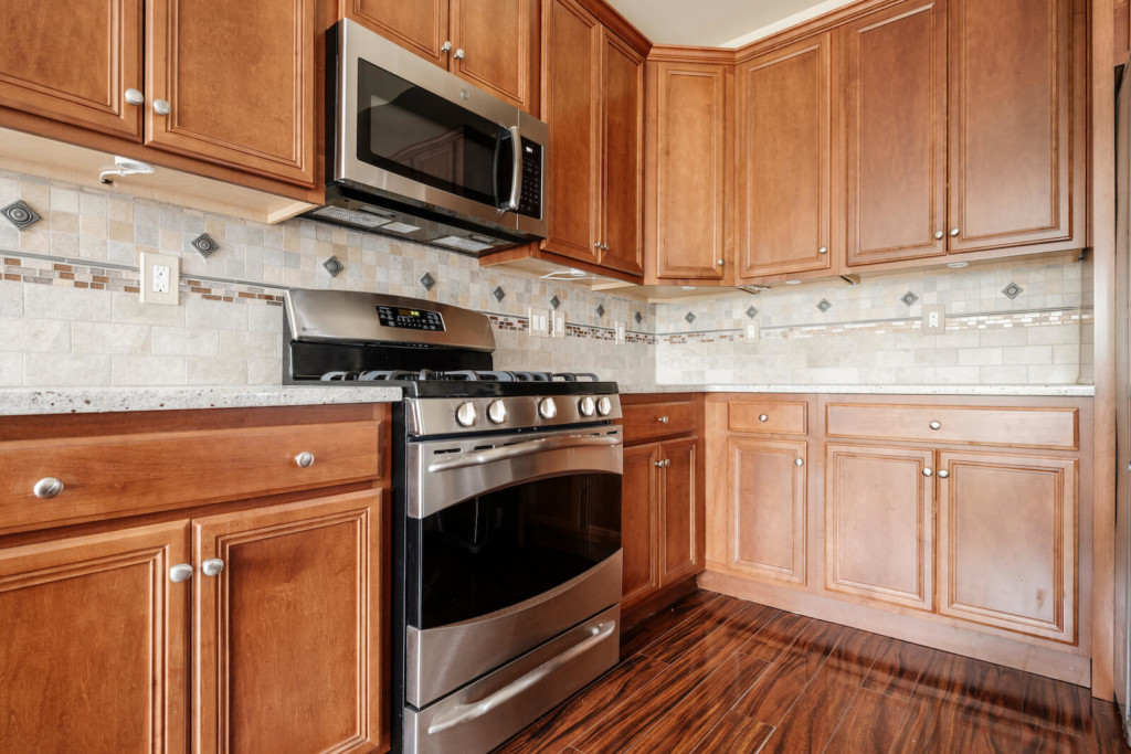 brown wood cabinets before door replacement