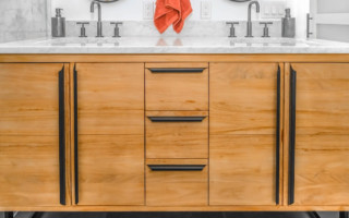 modern kitchen with light brown wood cabinets