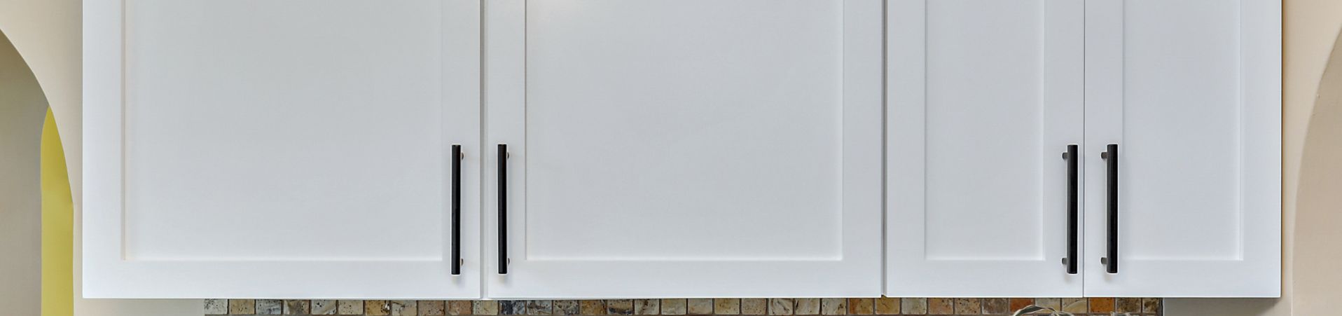 Photo of kitchen with blue and white refinished cabinets