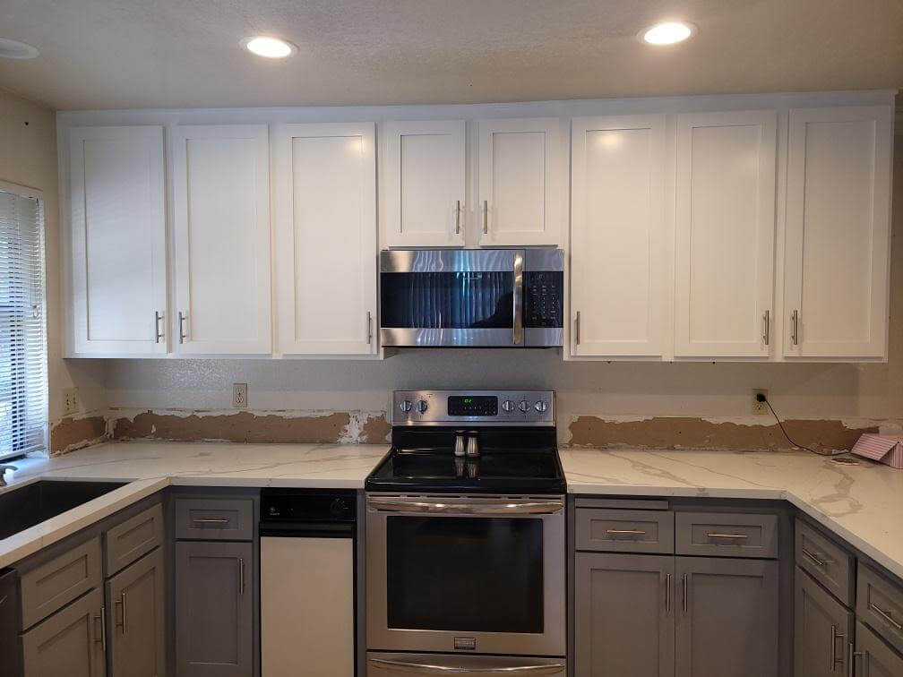 white cabinets in a kitchen after refacing