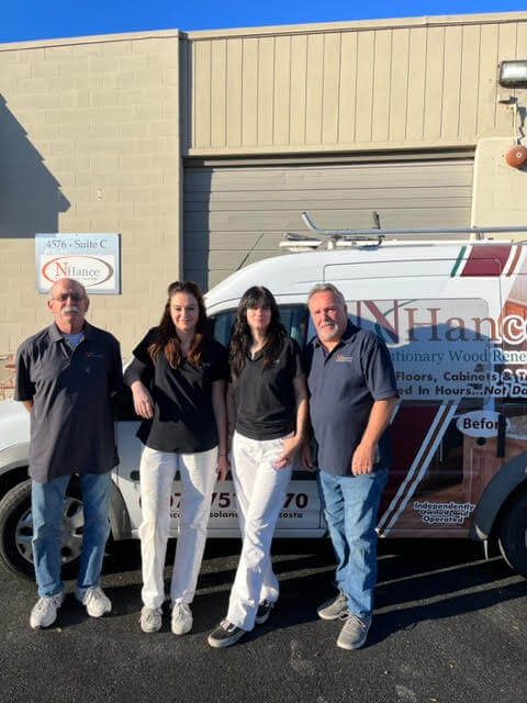 The N-Hance of Solano County team next to a van