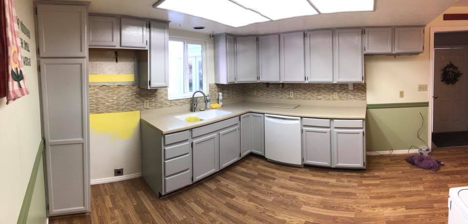 gray apartment kitchen cabinet refinishing after