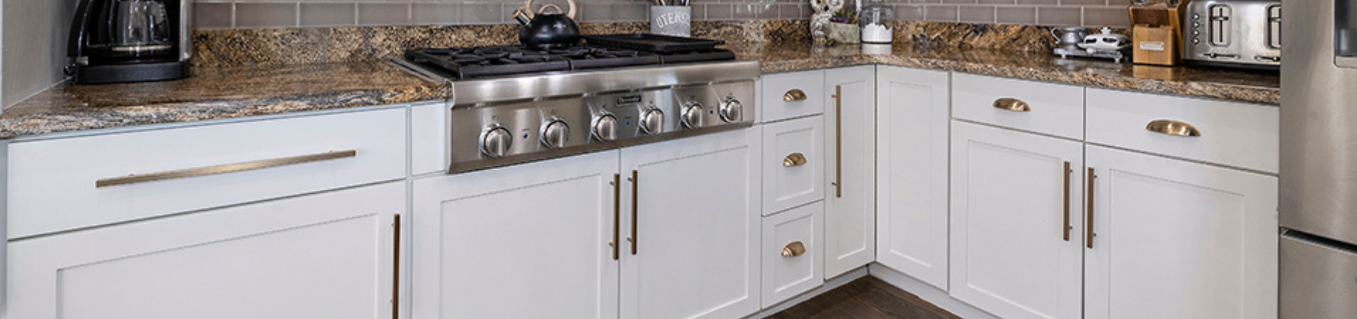 Photo of kitchen with blue and white refinished cabinets