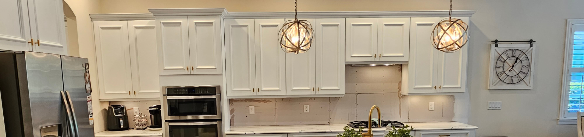 Photo of kitchen with blue and white refinished cabinets