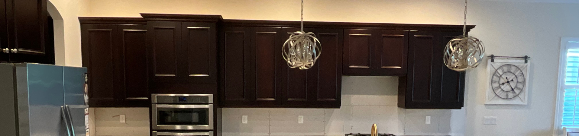 Photo of kitchen with old cabinets before refinishing