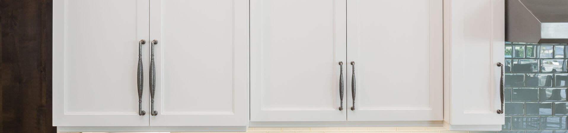 Photo of kitchen with blue and white refinished cabinets