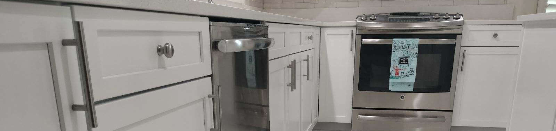 Photo of kitchen with blue and white refinished cabinets