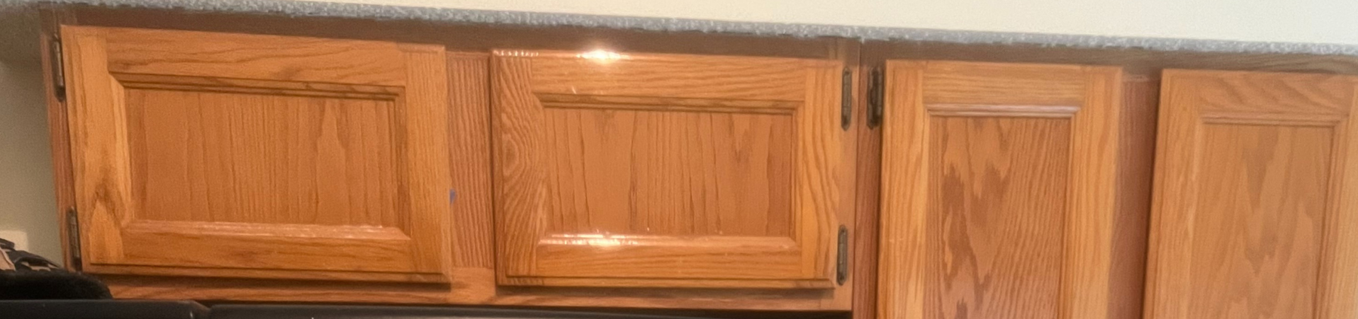 Photo of kitchen with old cabinets before refinishing