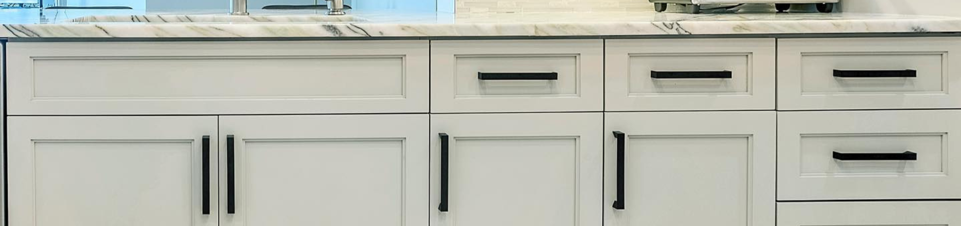 Photo of kitchen with blue and white refinished cabinets
